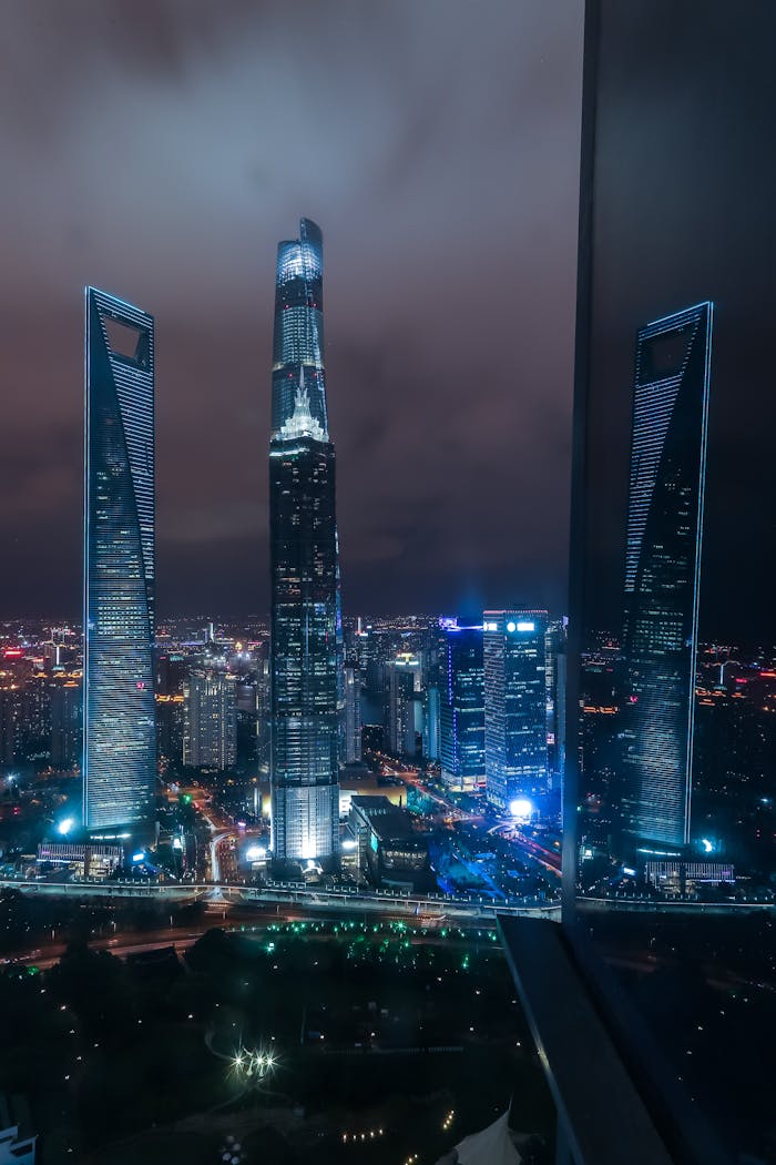 Breathtaking view of Shanghai's illuminated skyscrapers at night, showcasing modern architecture.